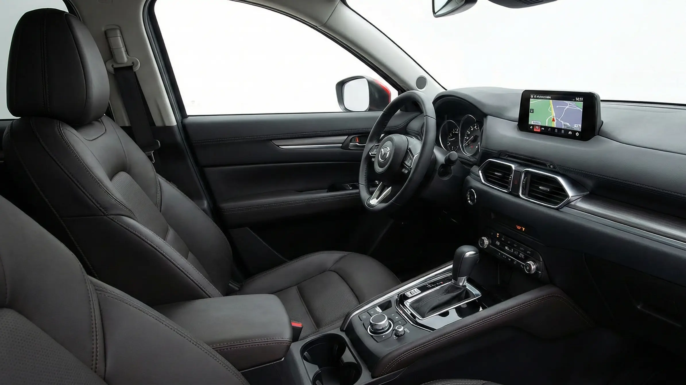 Mazda CX-5 driver-focused interior showing premium materials and command dial infotainment system